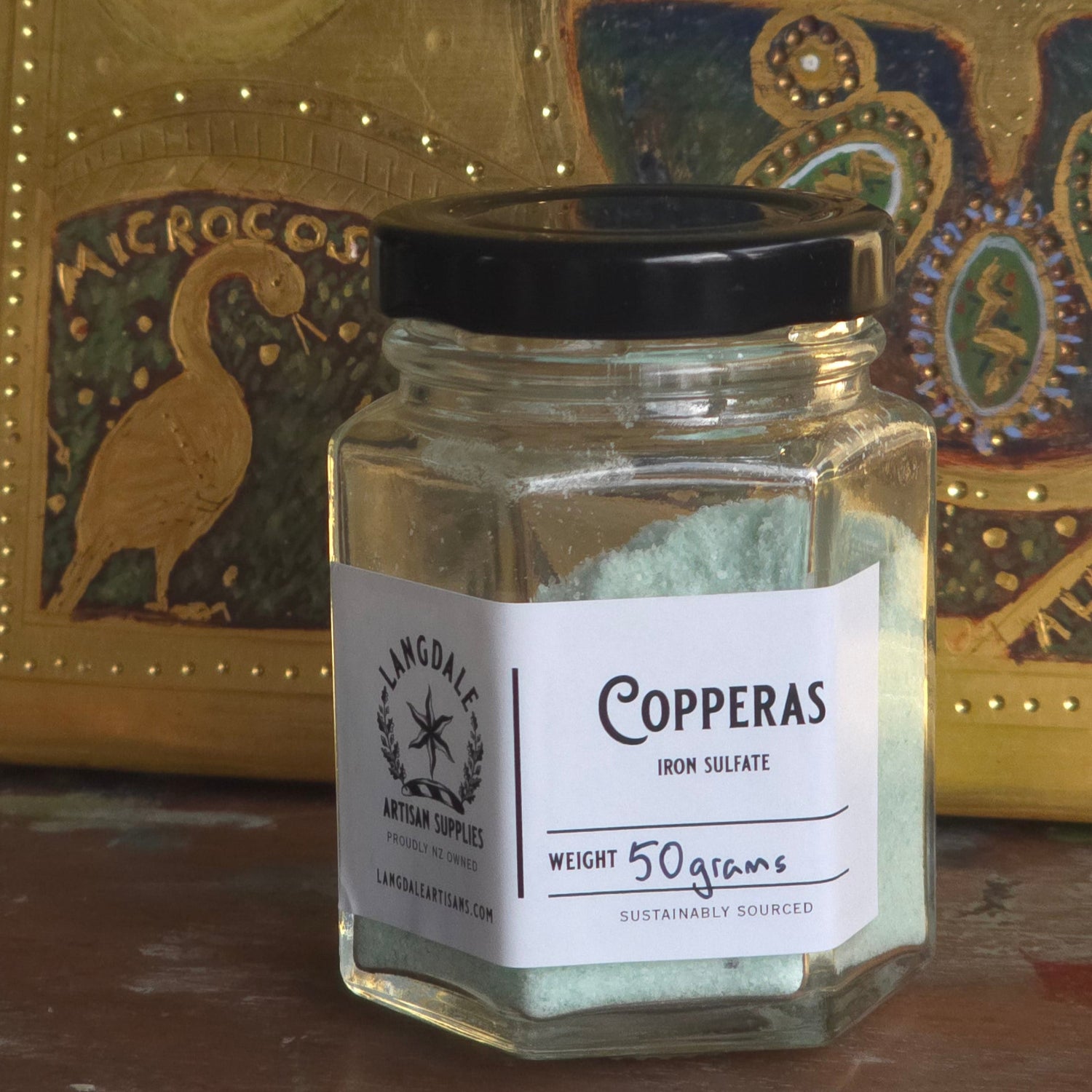 Small bottle of Copperas on a decorative surface